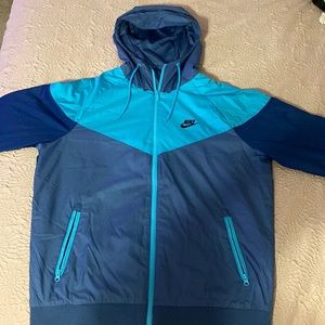 Men’s medium, blue variation Nike track suit jacket.